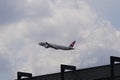 Airplane of company Swiss departing from Zurich Airport heading upwards. On the background there is overcast sky. Royalty Free Stock Photo