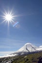 Kluchevskoy volcano and sun Royalty Free Stock Photo