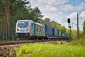 KLV 187 electric locomotive on a railroad surrounded by trees