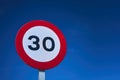 30 kmh mph speed limit traffic sign over a blue sky