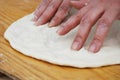 Knead and streach pizza Royalty Free Stock Photo