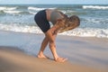 Kneading body muscles after jogging. Blond caucasian Girl massage her leg Royalty Free Stock Photo