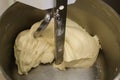 Kneading dough. Mixing dough kneading machine. Pizza dough.