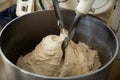 Kneading machine preparing dough Royalty Free Stock Photo