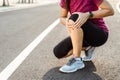 Knee Injuries. sport woman with strong athletic legs holding knee with her hands in pain after suffering muscle injury during a Royalty Free Stock Photo