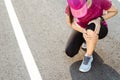 Knee Injuries. sport woman with strong athletic legs holding knee with her hands in pain after suffering muscle injury during a Royalty Free Stock Photo