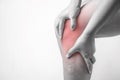 Knee injury in humans .knee pain,joint pains people medical, mono tone highlight at knee Royalty Free Stock Photo