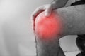 Knee injury in humans .knee pain,joint pains people medical, mono tone highlight at knee Royalty Free Stock Photo