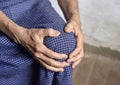 Knee joint pain in Asian old man. Concept of osteoarthritis, rheumatoid arthritis, patellar tendonitis, prepatellar bursitis,