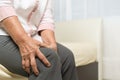 Knee pain of old woman at home, healthcare problem of senior concept Royalty Free Stock Photo