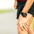 Knee pain running injury Royalty Free Stock Photo