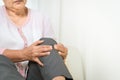 Knee pain of senior woman at home, healthcare problem of senior concept Royalty Free Stock Photo