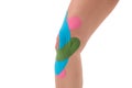 Knee treated with kinesio tex tape therapy Royalty Free Stock Photo