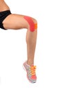 Knee treated with tape therapy Royalty Free Stock Photo