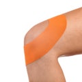 Knee treated with tape therapy Royalty Free Stock Photo