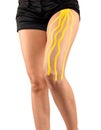 Knee treated with tape therapy Royalty Free Stock Photo