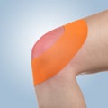 Knee treated with tape therapy Royalty Free Stock Photo