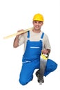 Kneeled carpenter with a handsaw. Royalty Free Stock Photo