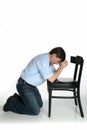 Kneeling man prays Royalty Free Stock Photo