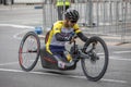 A kneeling Para Cyclist races along Pulteney Street in Adelaide.