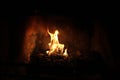 Kneeling prayer from inside the flames in fireplace