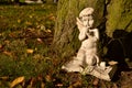 Kneeling praying old cherub statute