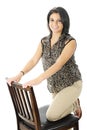 Kneeling on a Tall Chair Royalty Free Stock Photo