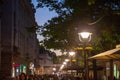 Kneza Mihailova street at night, crowded, with blurred people rushing.