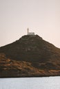 Knidos Lighthouse on mountain top in Turkey above Aegean sea landscape