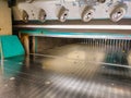 Knife area of an industrial guillotine paper cutter in a Book Bindery