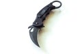 Knife blade in the form of a claw. Knife on a white background. Black tactical knife.