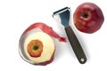 Knife for cleaning fruits and vegetables with apple with peeled skin.