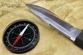 Knife and Compass on the Camouflage Background