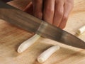 Knife cut lemon glass on chopping board