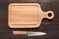 Knife and cutting board on the wooden background. Copy space for Royalty Free Stock Photo