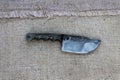 Knife blade fixed to the sacking. Royalty Free Stock Photo