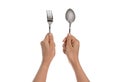 A knife and fork being held by woman's hands. Isolated Royalty Free Stock Photo