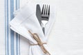 Knife and fork with blue and white linen Royalty Free Stock Photo
