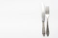 knife, fork, fancy silver cutlery on white