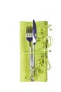 Knife and fork with green linen napkin