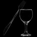 Knife and fork leaning on wine glass Royalty Free Stock Photo