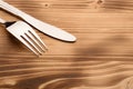 Knife and fork set on a wooden vintage table Royalty Free Stock Photo