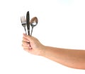 Knife, Fork and spoon held by a man's hands isolated Royalty Free Stock Photo