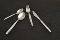 Knife, fork, teaspoon and dessert spoon Royalty Free Stock Photo