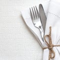 Knife and fork with white linen Royalty Free Stock Photo