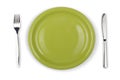 Knife, green plate and fork isolated top view