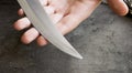 Knife with its blade in hand Royalty Free Stock Photo