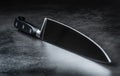 Knife. Kitchen knife lying on an modern concrete cutting board Royalty Free Stock Photo