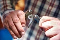 knife multitool turned into pliers in the hands of a man Royalty Free Stock Photo