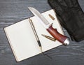 Knife and notebook Royalty Free Stock Photo